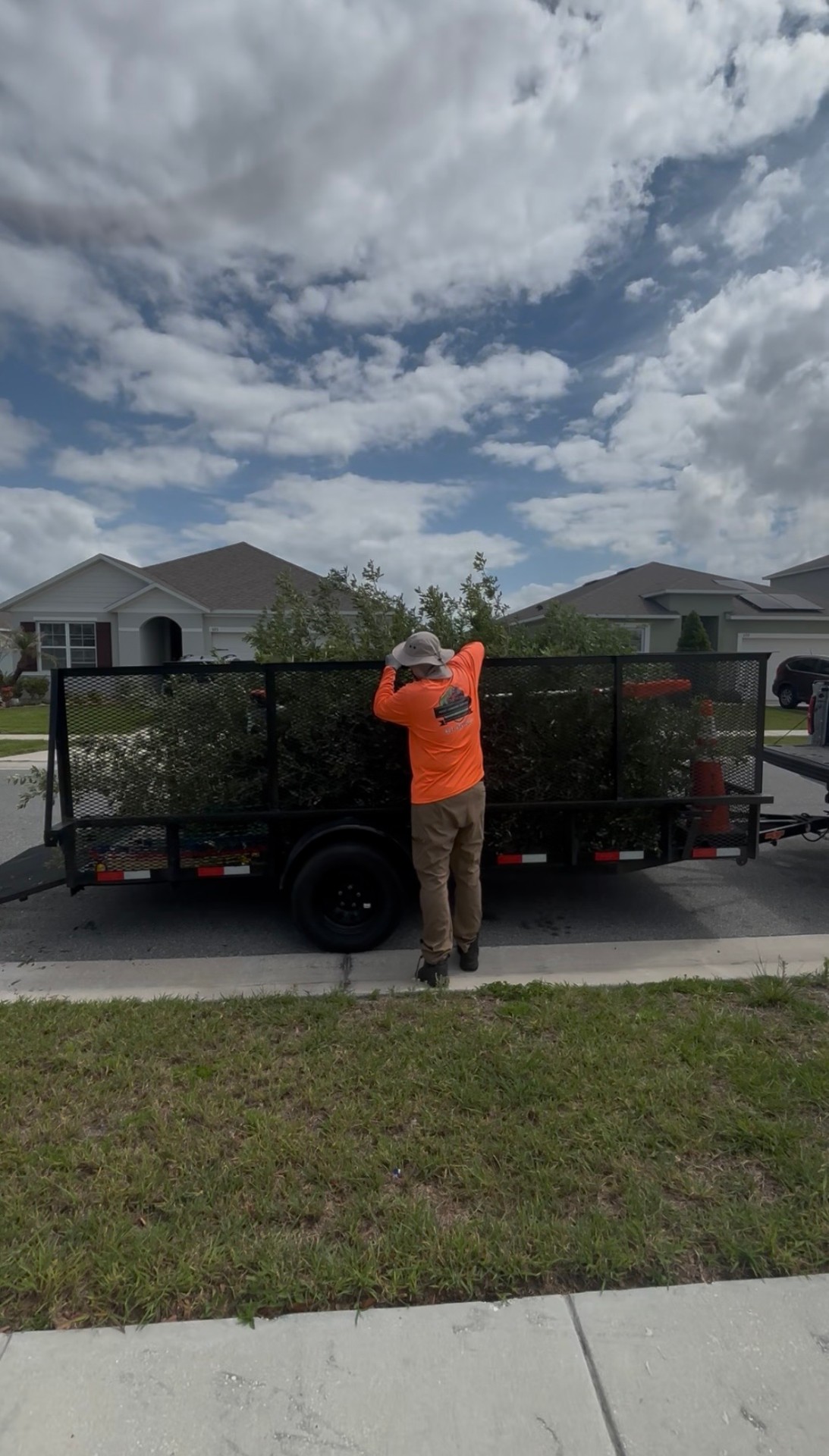 Rocky Landscape Services crew clearing a property with a leaf blower